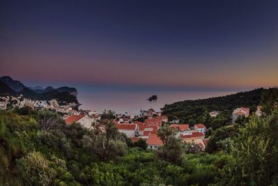 High angle view of houses by sea