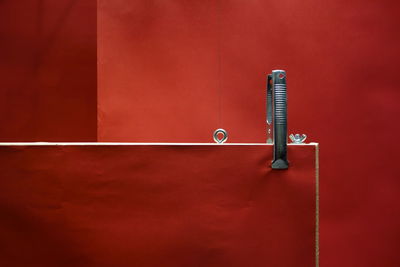 Close-up of metallic pipe against wall