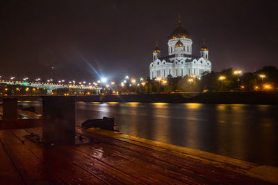 Illuminated buildings at waterfront