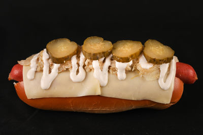 Close-up of cake on table against black background