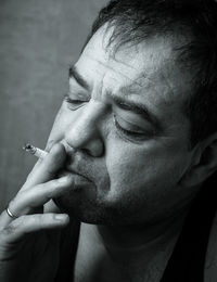 Close-up of man smoking cigarette