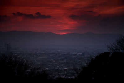 Scenic view of mountains against sky at sunset