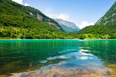 Scenic view of lake and mountains against sky