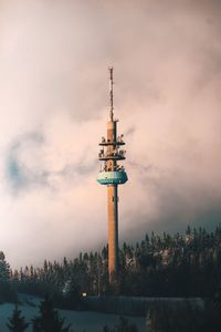 Low angle view of communications tower against sky during sunset