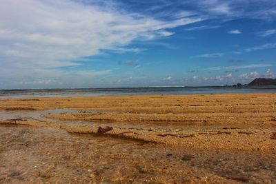 Scenic view of beach against sky with an aesthetic sand on gili air island, lombok indonesia 