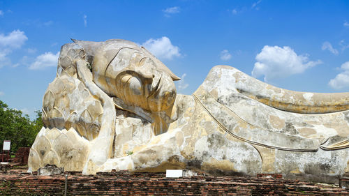 Low angle view of statue against cloudy sky