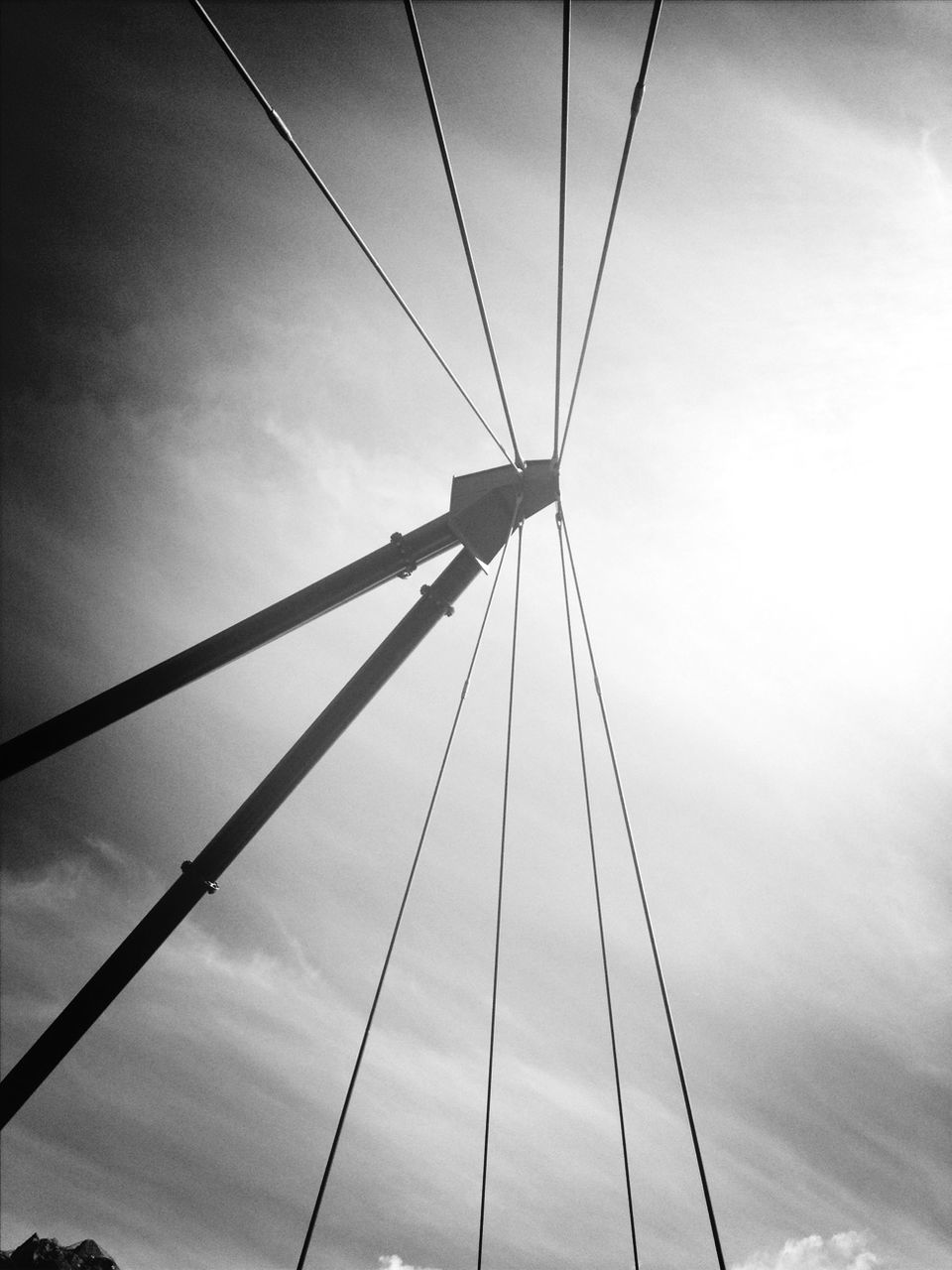 low angle view, connection, sky, cable, power line, electricity pylon, cloud - sky, electricity, power supply, cloud, engineering, built structure, cloudy, bridge - man made structure, transportation, day, outdoors, technology, fuel and power generation, steel cable