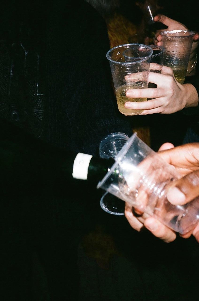 drink, refreshment, food and drink, glass, human hand, holding, hand, alcohol, drinking glass, human body part, one person, household equipment, leisure activity, real people, lifestyles, men, event, indoors, drinking, nightlife, finger