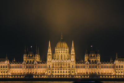 Illuminated hungarian parliament  against sky at night