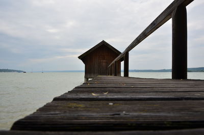 Pier over sea against sky