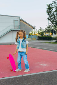 Portrait of girl standing on road