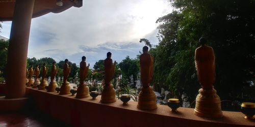 View of buddha statue against trees