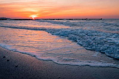 Scenic view of sea against sky during sunset