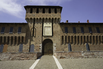 Low angle view of old building against sky