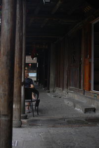 Young woman sitting at home