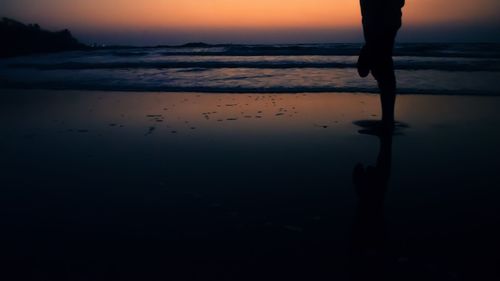 Silhouette of people at beach