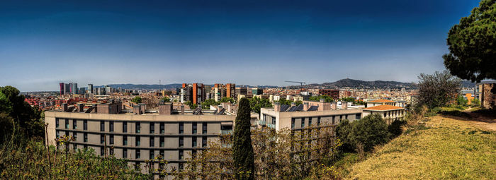 High angle view of townscape against blue sky