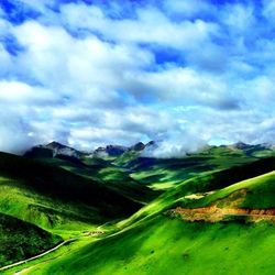 Scenic view of landscape against cloudy sky