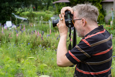 Man photographing with camera