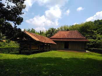 House on field against sky