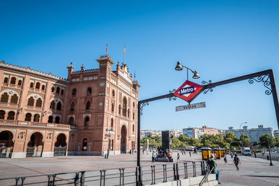 View of buildings against blue sky