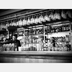 Man standing in glass of store