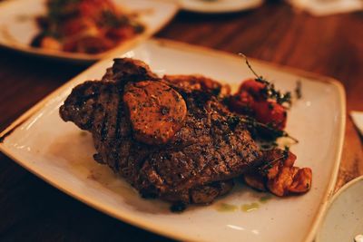 High angle view of meat in plate on table