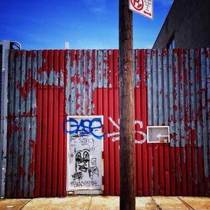 Graffiti on wall against sky