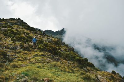 Volcanic rock formations against a foggy mountain background, aberdare ranges, kenya