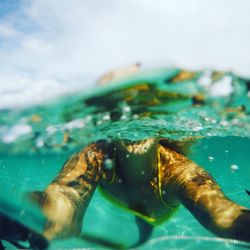 Young woman swimming undersea