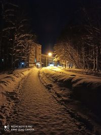 Illuminated city street at night