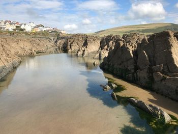 Panoramic view of rocks on land against sky