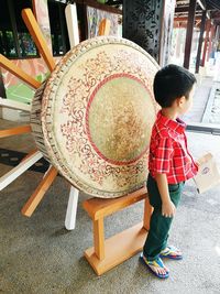 Boy sitting on chair