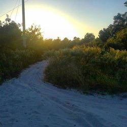 Scenic view of landscape against sky at sunset