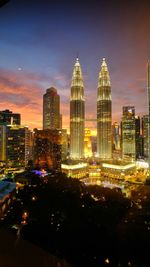 Illuminated buildings in city at night