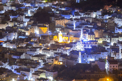 High angle view of illuminated buildings at night