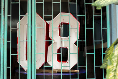 Close-up of red window hanging on building