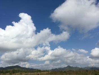 Scenic view of landscape against blue sky