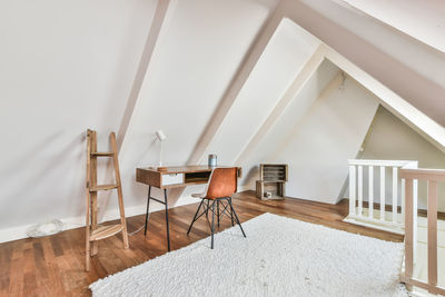 View of chair in loft apartment