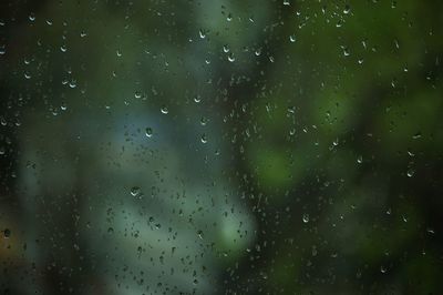 Full frame shot of wet window in rainy season