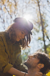 Happy young couple embracing in a park