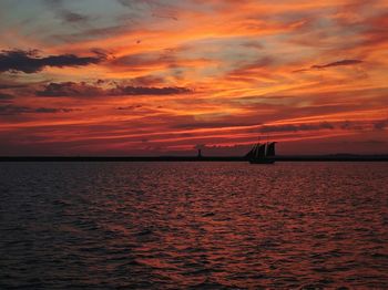 Scenic view of sea against dramatic sky