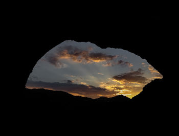 Silhouette mountains against sky during sunset