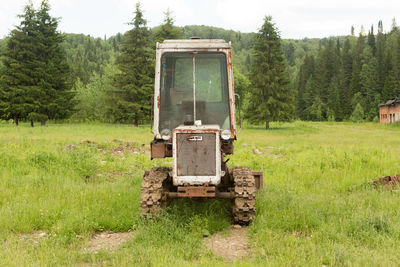 Abandoned truck on field