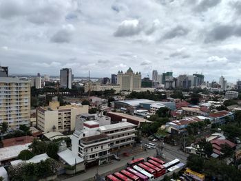 High angle view of buildings in city against sky