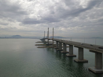 Pier over sea against sky