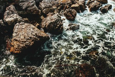 High angle view of rock formation in sea