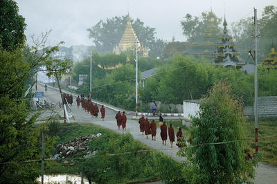 Group of people in temple by building