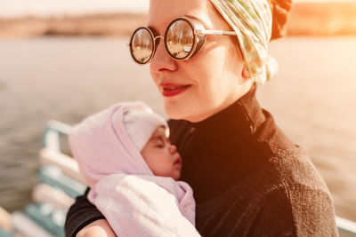 Portrait of mother with baby in water