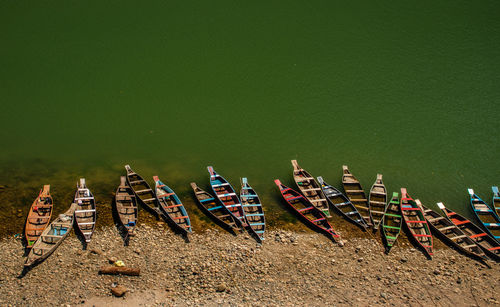 High angle view of boats moored on beach